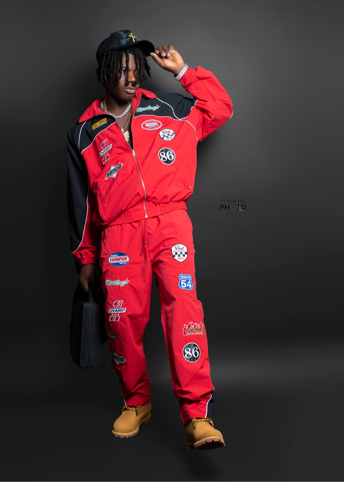 Full-body studio portrait in a racing outfit